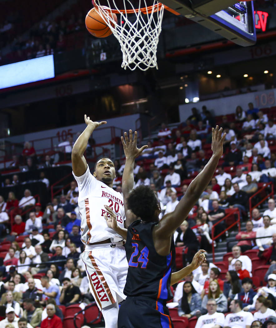 UNLV Rebels' Nick Blair (20) shoots over Boise State Broncos' Abu Kigab (24) during the second ...