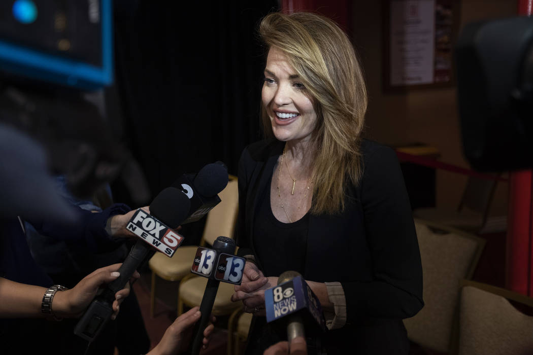 Amy Purdy, a Paralympic snowboarder, speaks to the media after being inducted into the Southern ...