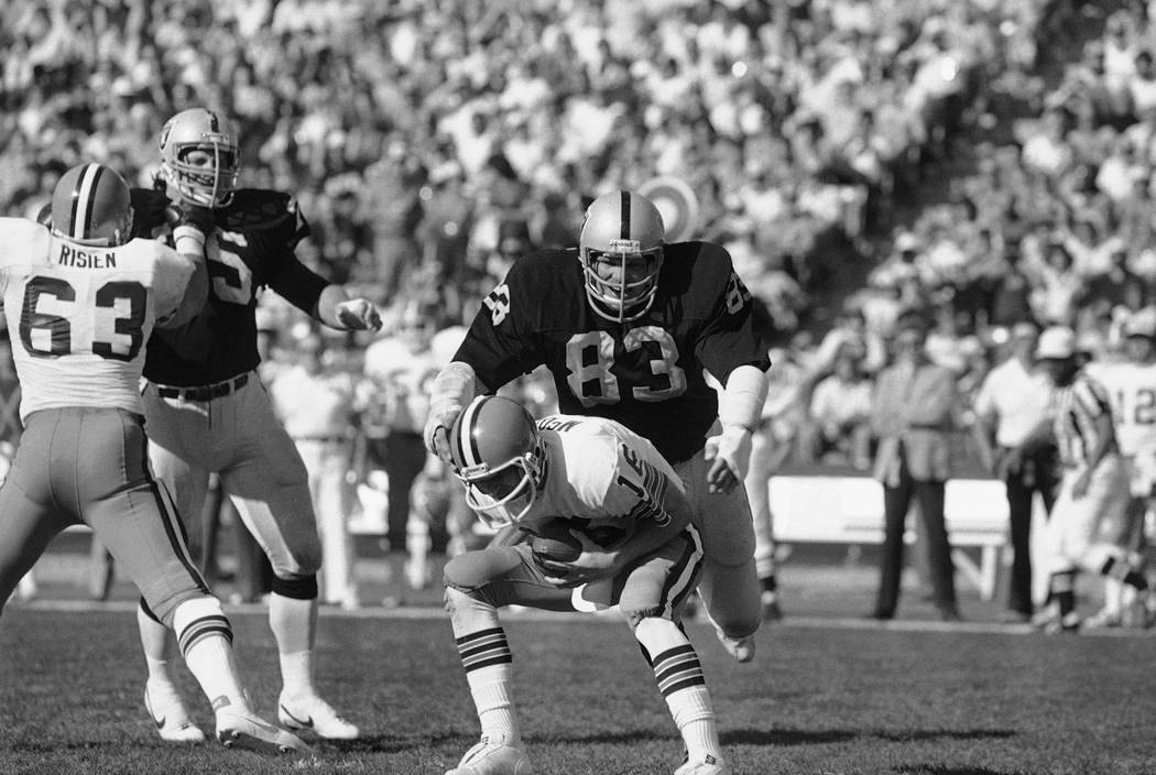 Los Angeles Raiders' Ted Hendricks, (83) proceeds to tackle Cleveland Browns' quarterback Paul ...