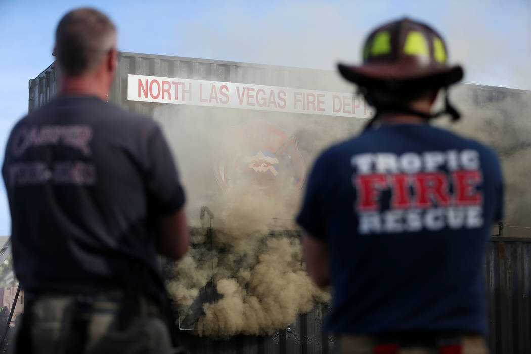 Multiagency firefighters participate during a live fire training at Fire Station 52 in North La ...