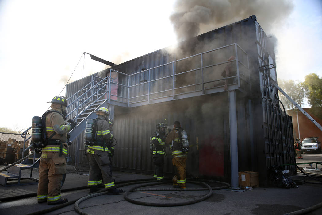 Multiagency firefighters participate during a live fire training at Fire Station 52 in North La ...
