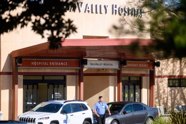 A security guard leaves NorthBay VacaValley Hospital, where a woman diagnosed with coronavirus ...
