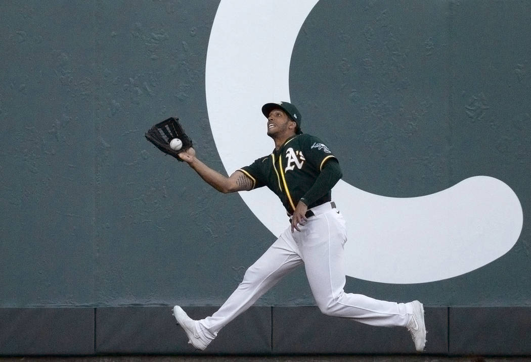 Oakland Athletics right fielder Dillon Thomas makes a leaping grab to end the game in the ninth ...