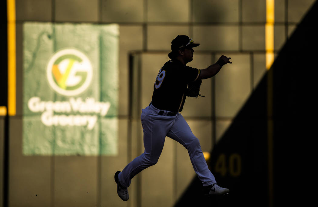 Oakland Athletics second baseman Trace Loehr (99) makes a leaping throw in the ninth inning dur ...