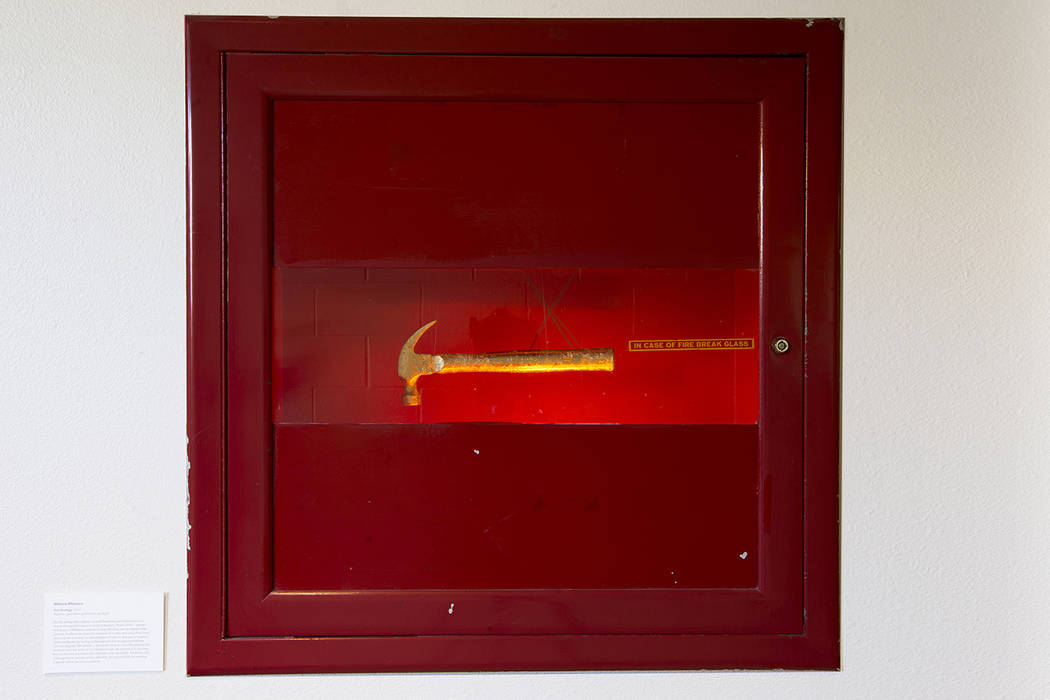 “Exit Strategy” 2019, Hammer, gold paint, gold Mylar, spotlight (Erik Verduzco)