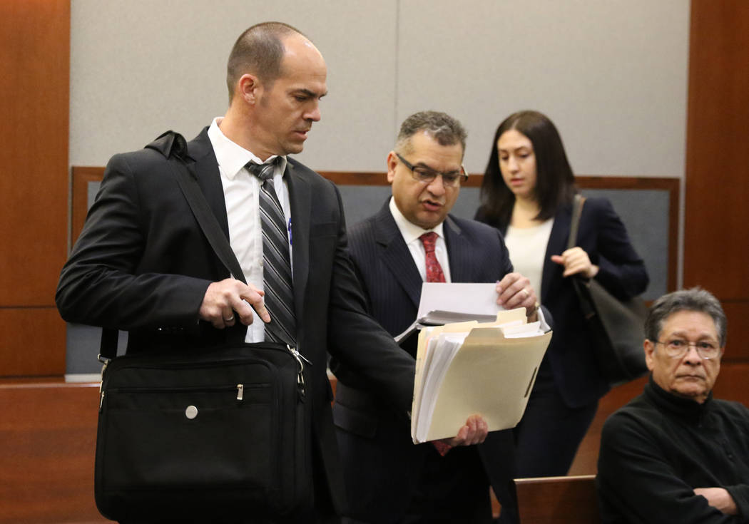 Chief Deputy District Attorney, Richard Scow, left, and Defense attorney Chris Oram, center, wh ...