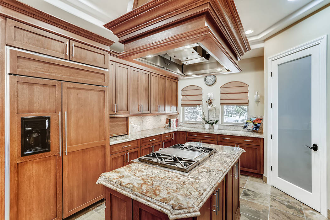 A large center island is showcased in the kitchen. (Berkshire Hathaway HomeServices)