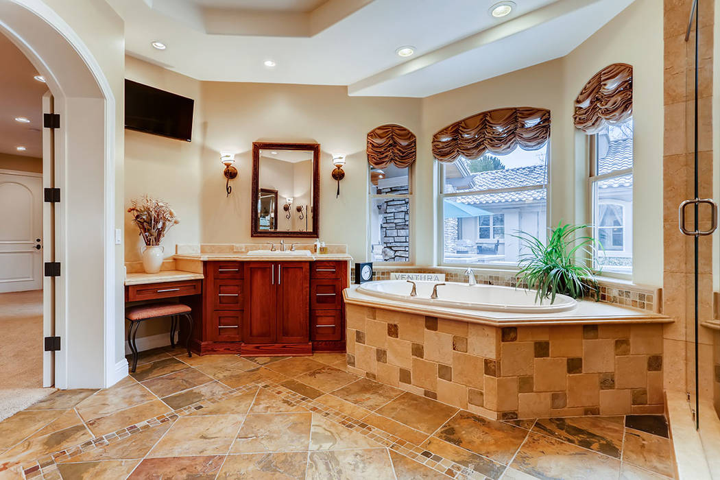 The spa-like bath features a large soaking tub. (Berkshire Hathaway HomeServices)