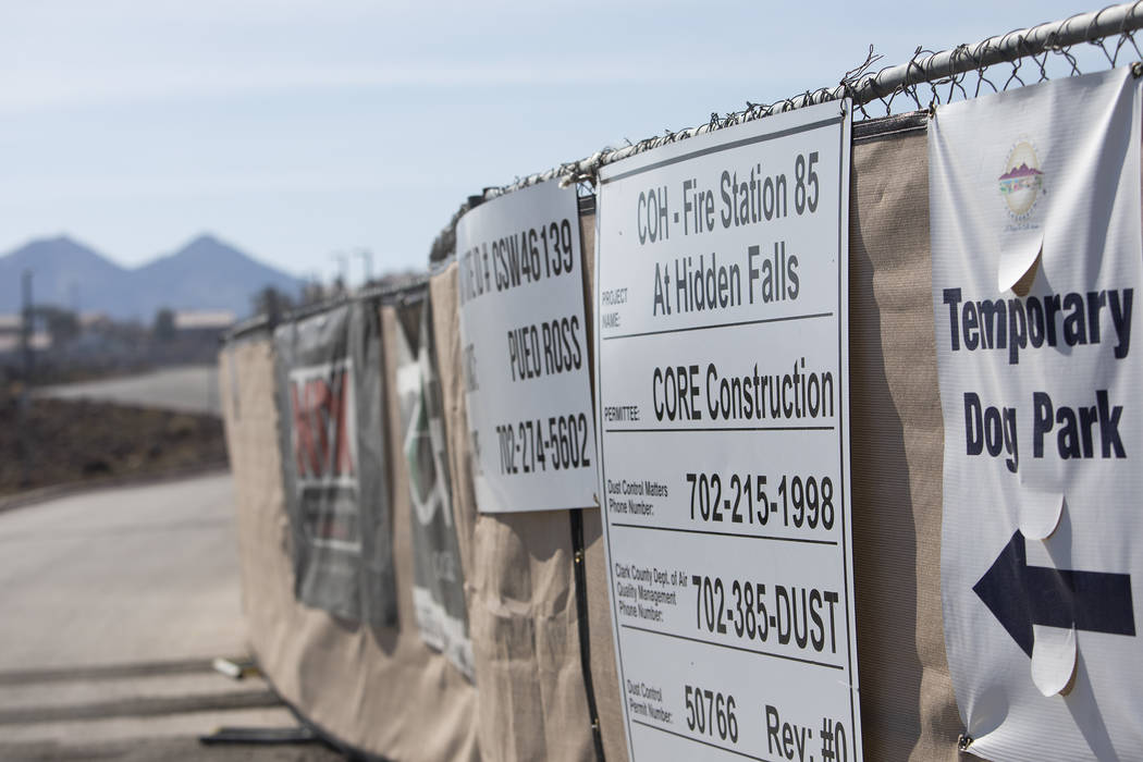 Signs mark construction for a new fire station and dog park at Hidden Hills Park on Thursday, F ...