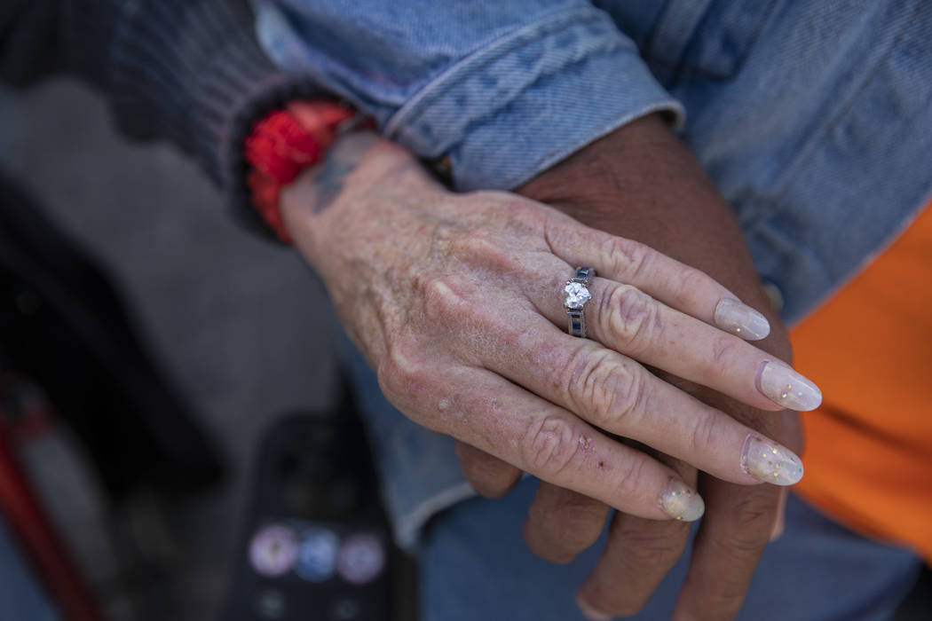 Donna Charles, 65, left, and Robert Caris, 63, hold hands in front of their new SHARE module co ...