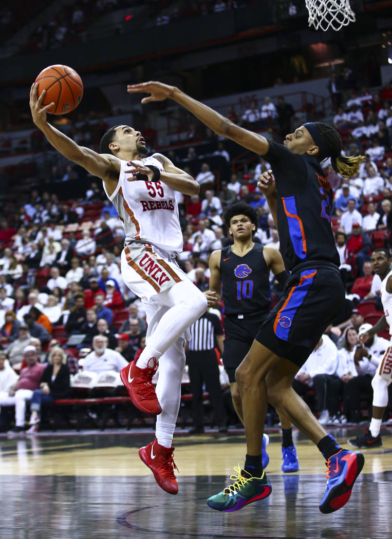 UNLV Rebels' Elijah Mitrou-Long (55) goes to the basket against Boise State Broncos' Derrick Al ...