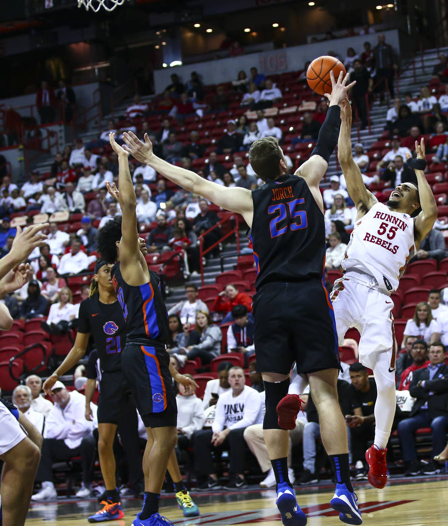 UNLV Rebels' Elijah Mitrou-Long (55) shoots over Boise State Broncos' Robin Jorch (25) during t ...