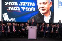 Israeli Prime Minister Benjamin Netanyahu, center, speaks during a Likud faction meeting in Tel ...
