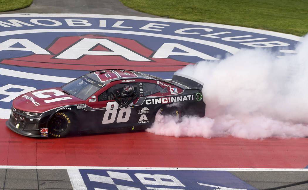 Alex Bowman celebrates with a burnout after winning a NASCAR Cup Series auto race Sunday, March ...