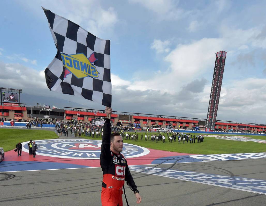 Alex Bowman celebrates with the checkered flag after winning a NASCAR Cup Series auto race Sund ...