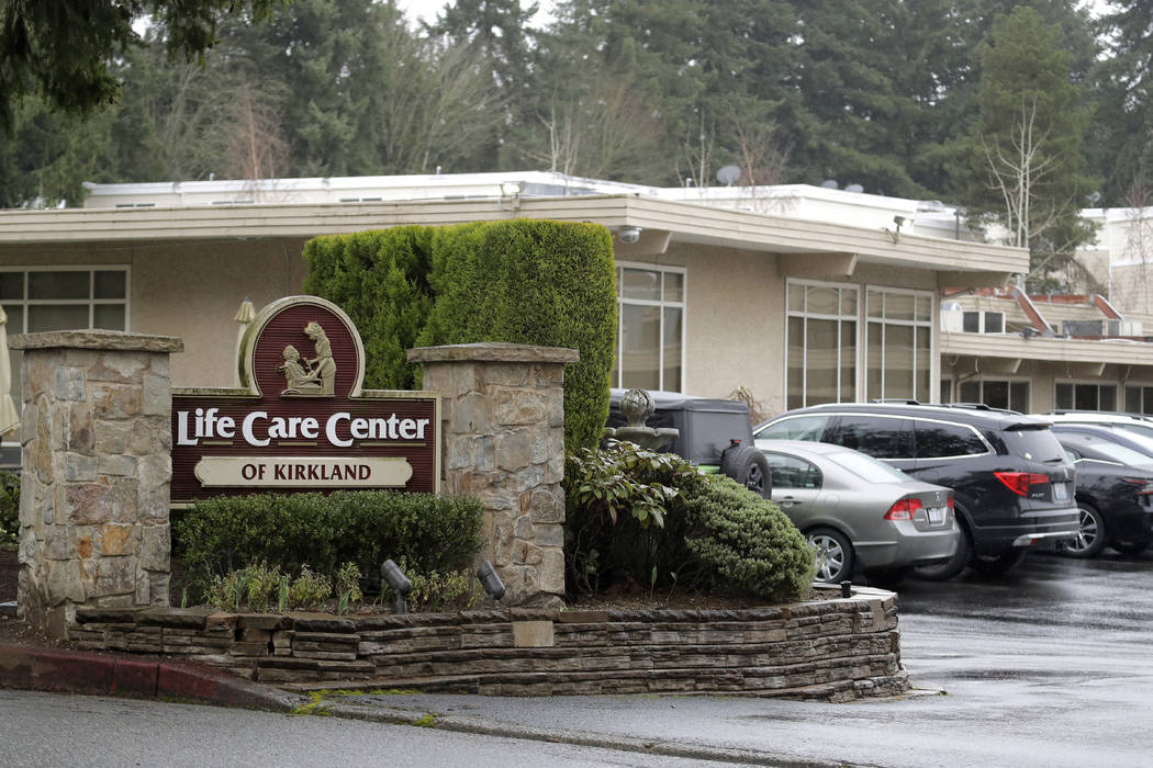 A sign at the entrance of the Life Care Center is show in Kirkland, Wash., near Seattle, Monday ...