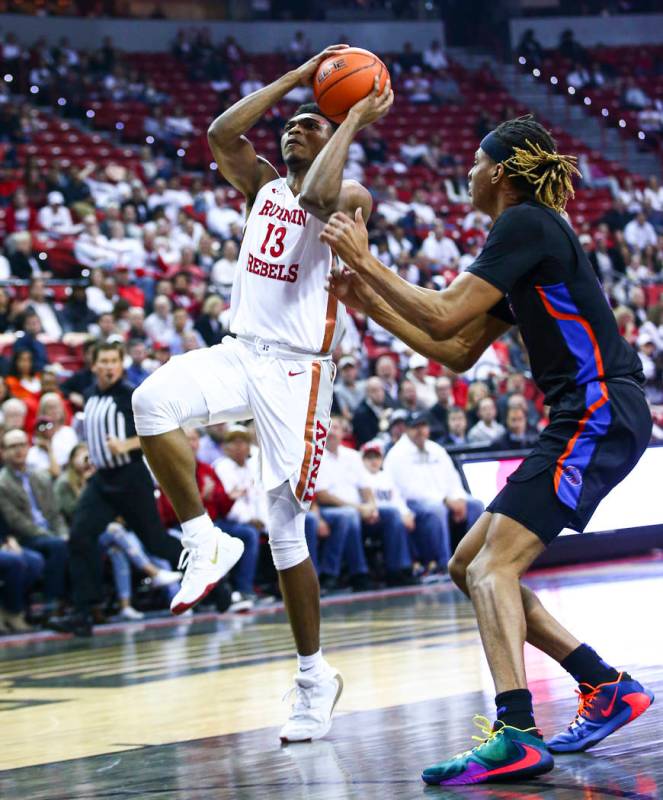 UNLV Rebels' Bryce Hamilton (13) goes to the basket past Boise State Broncos' Derrick Alston (2 ...