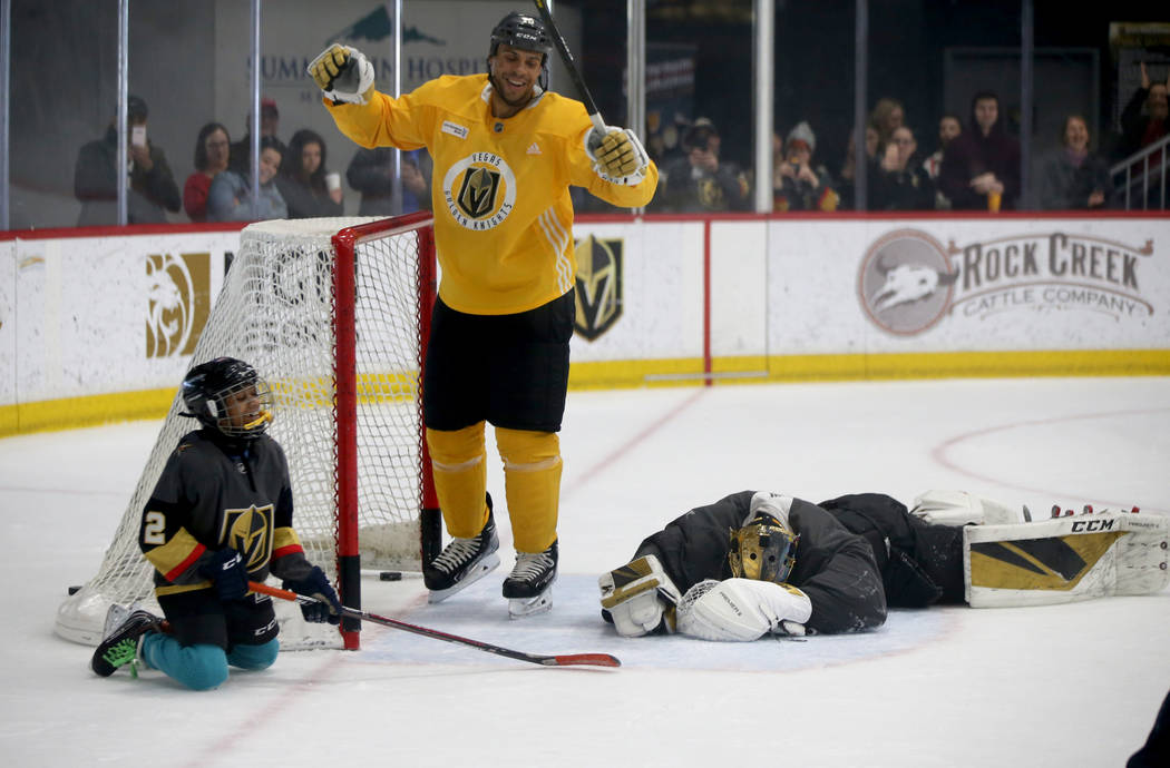 Make-A-Wish kid Arjun Jain, 12, of Somerset, N.J. shoots on Vegas Golden Knights goaltender Mar ...