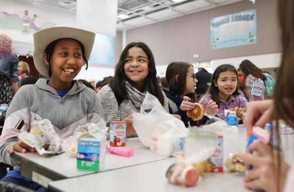 Students eat their breakfast during the Clark County School District's first day of universal f ...