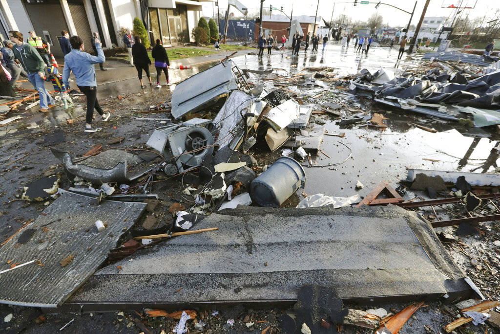 Debris covers a street after overnight storms Tuesday, March 3, 2020, in Nashville, Tenn. Torna ...