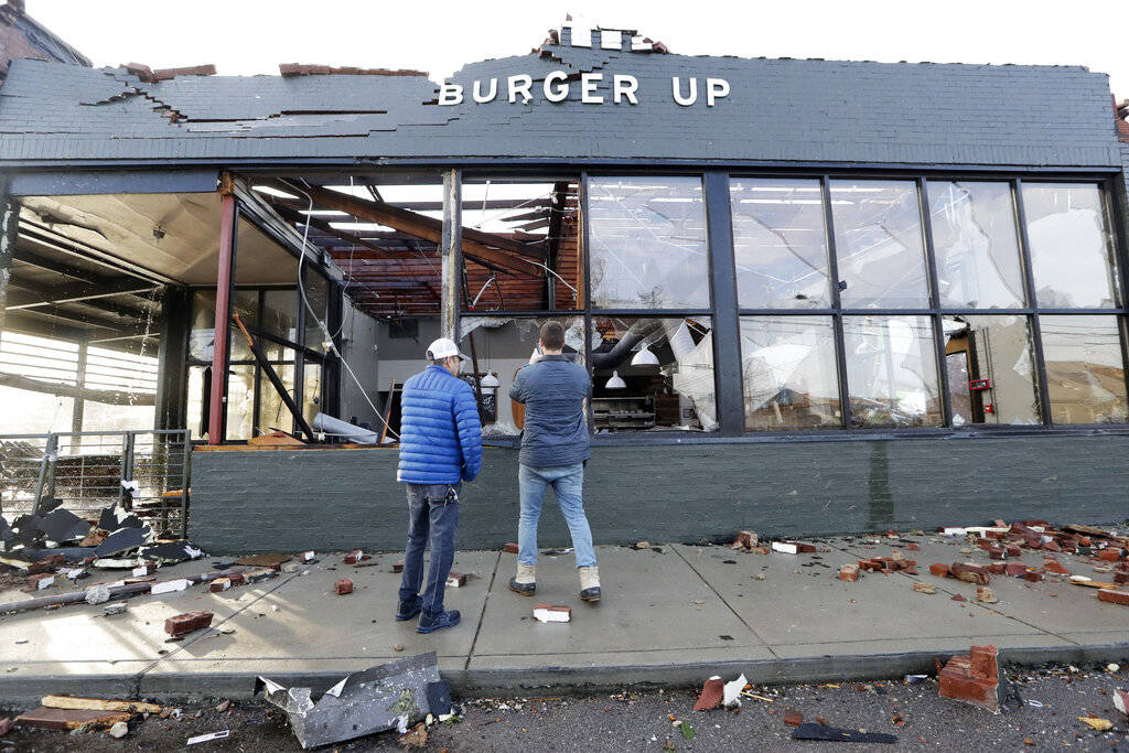 People look over a restaurant destroyed by storms Tuesday, March 3, 2020, in Nashville, Tenn. T ...