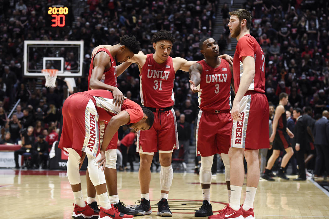 UNLV players huddle before an NCAA college basketball game against San Diego State Saturday, Fe ...