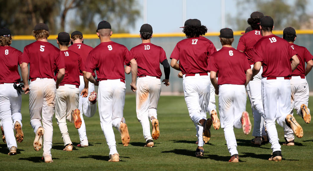 Desert Oasis baseball players start practice at the school in Las Vegas Wednesday, March 4, 202 ...
