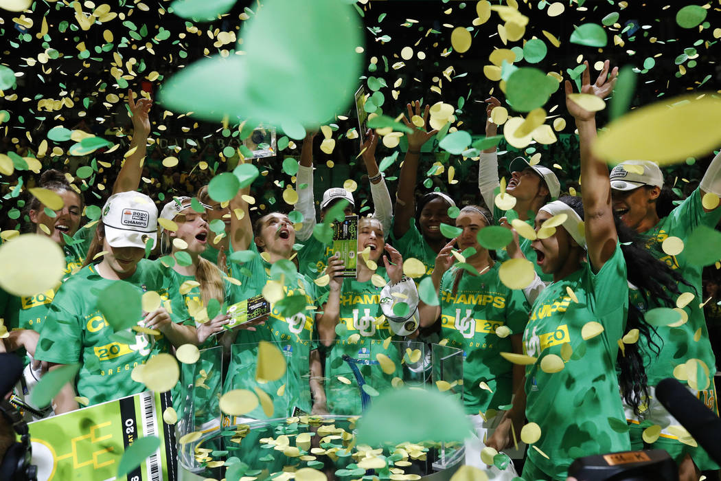 Oregon players celebrate after defeating Stanford in an NCAA college basketball game in the fin ...