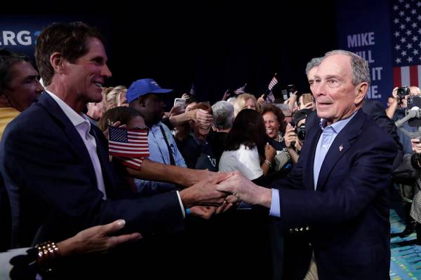 Democratic presidential candidate former New York City Mayor Mike Bloomberg shakes hands during ...