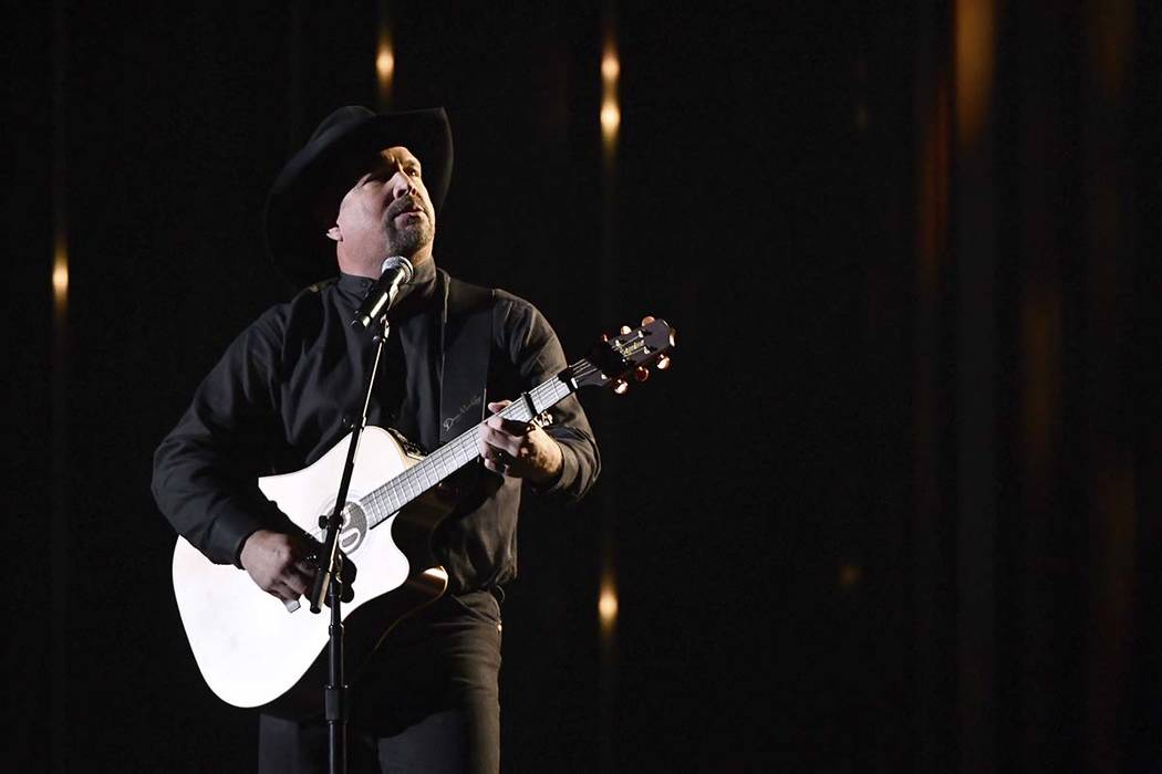 Garth Brooks performs "Stronger Than Me" at the 52nd annual CMA Awards at Bridgestone ...