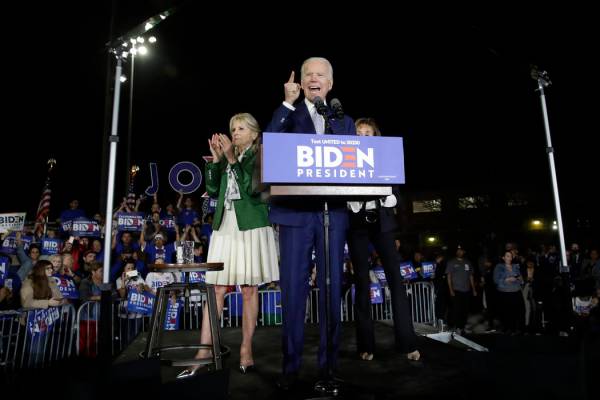 Democratic presidential candidate former Vice President Joe Biden speaks, next to his wife Jill ...