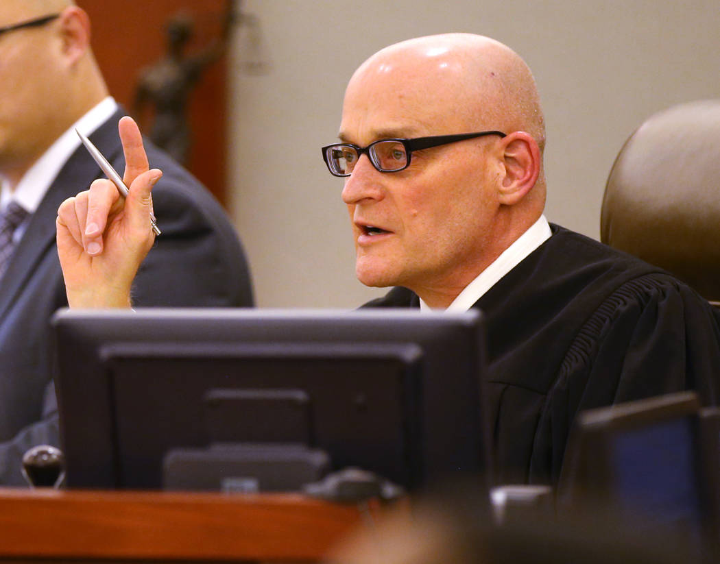 Clark County District Judge Rob Bare presides during a hearing at the Regional Justice Center i ...