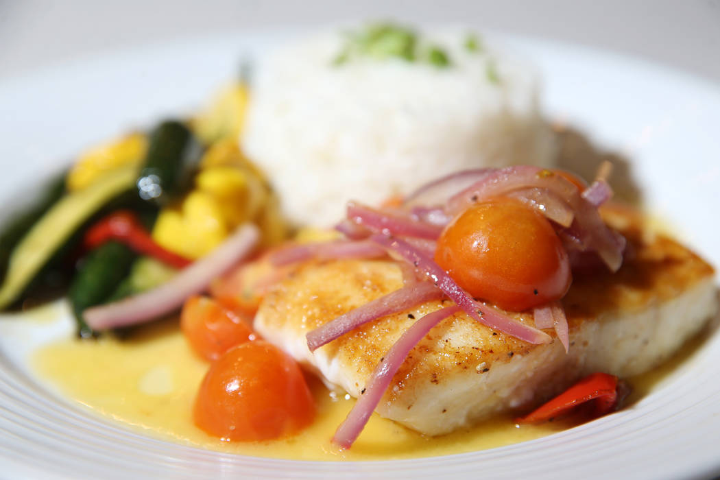 The pacific halibut served with tomato and red onion salad, steamed rice and beurre blanc sauce ...