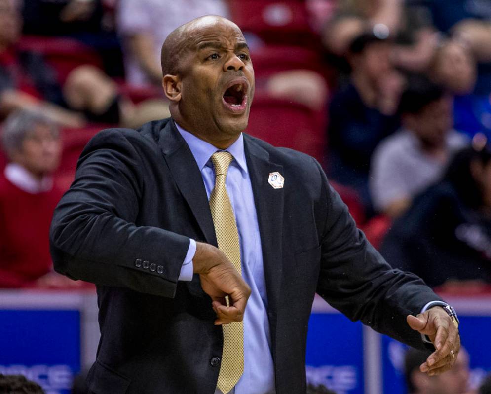 The San Jose State Spartans head coach Jean Prioleau calls in another play in their first half ...