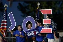 Supporters hold a sign before a campaign rally for Democratic presidential candidate former Vic ...