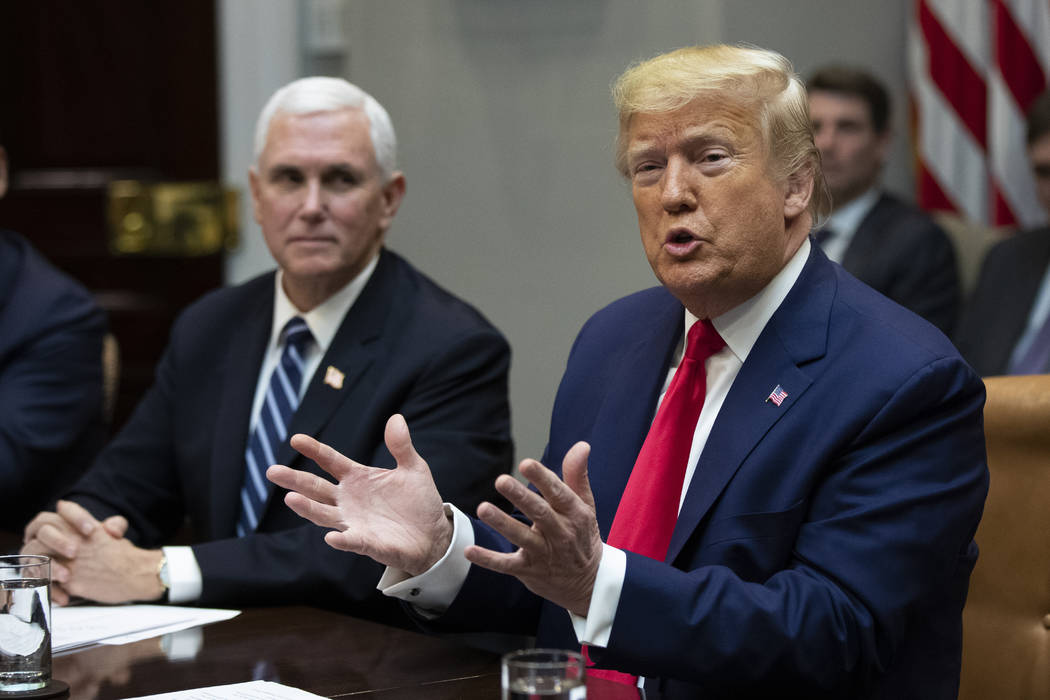 President Donald Trump with Vice President Mike Pence, speaks during a coronavirus briefing wit ...