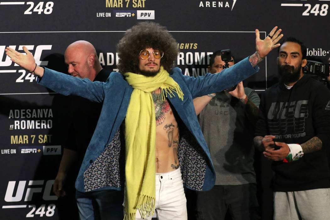 UFC bantamweight Sean O'Malley, left, poses during UFC 248 media day staredown as his opponent ...