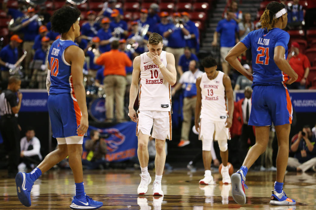 UNLV Rebels guard Jonah Antonio (10) followed by guard Bryce Hamilton (13) leave the court afte ...