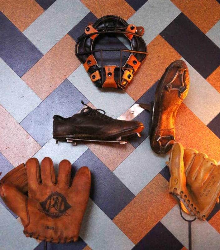 Old baseball catchers gear and cleats are displayed at the new sportsbook bar at Park MGM on Fr ...