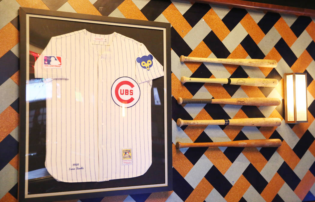 Baseball jersey and batts are displayed at the new sportsbook bar at Park MGM on Friday, March. ...