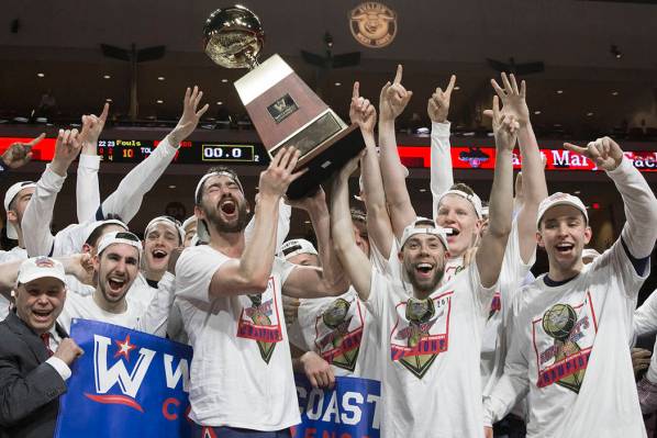 Saint Mary's hoists the trophy after upsetting Gonzaga 60-47 to win the West Coast Confere ...