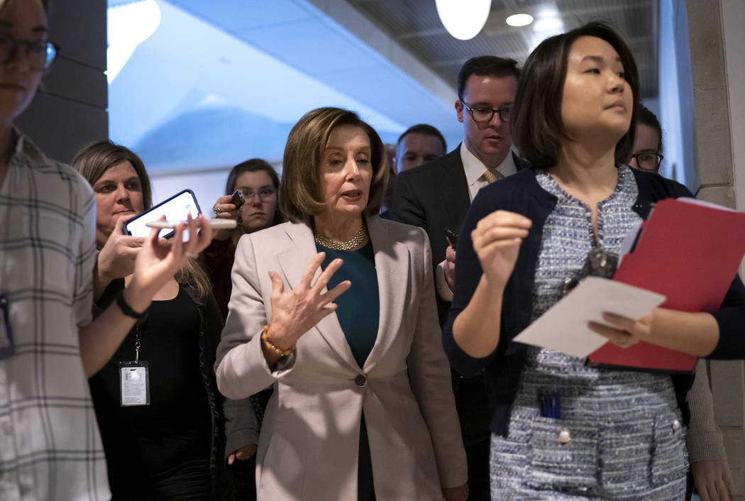 Speaker of the House Nancy Pelosi, D-Calif., arrives to meet with Vice President Mike Pence and ...