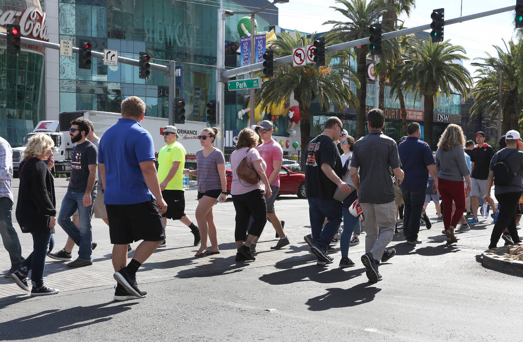 Tourists walk along Las Vegas Boulevard on Friday, March 6, 2020, in Las Vegas. (Bizuayehu Tesf ...