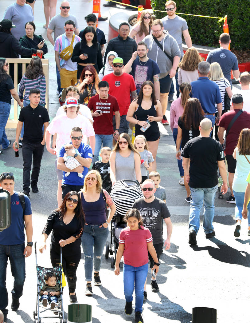 Tourists walk along Las Vegas Boulevard on Friday, March 6, 2020, in Las Vegas. (Bizuayehu Tesf ...