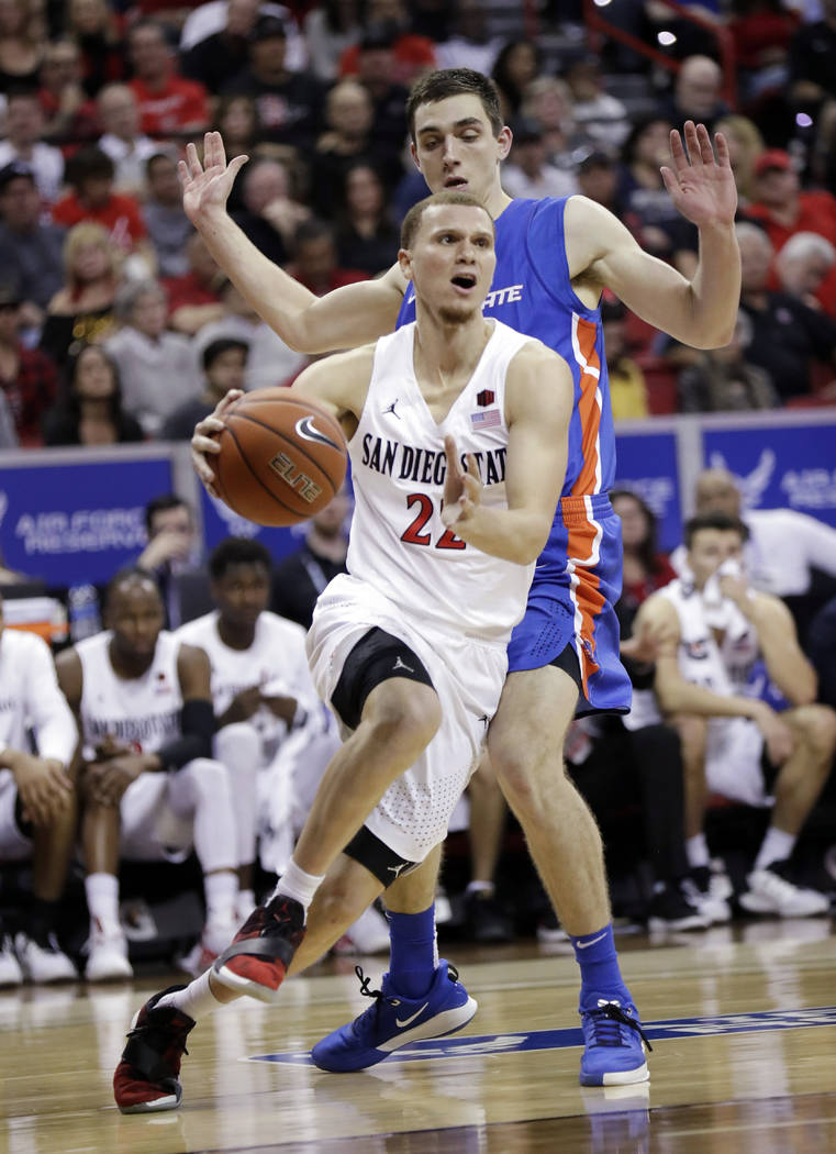 San Diego State's Malachi Flynn (22) drives to the hoop as Boise State's Justinian Jessup defen ...