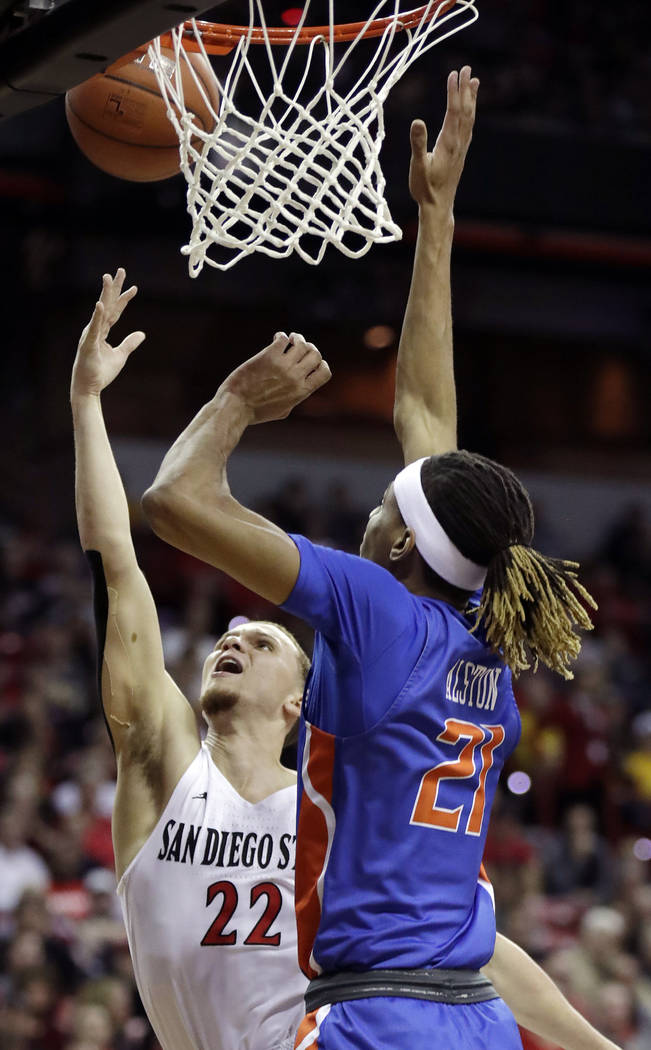San Diego State's Malachi Flynn (22) shoots as Boise State's Derrick Alston defends during the ...