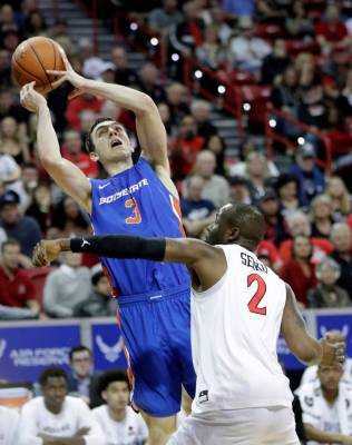 Boise State's Justinian Jessup (3) tries to shoot as San Diego State's Adam Seiko (2) defends d ...