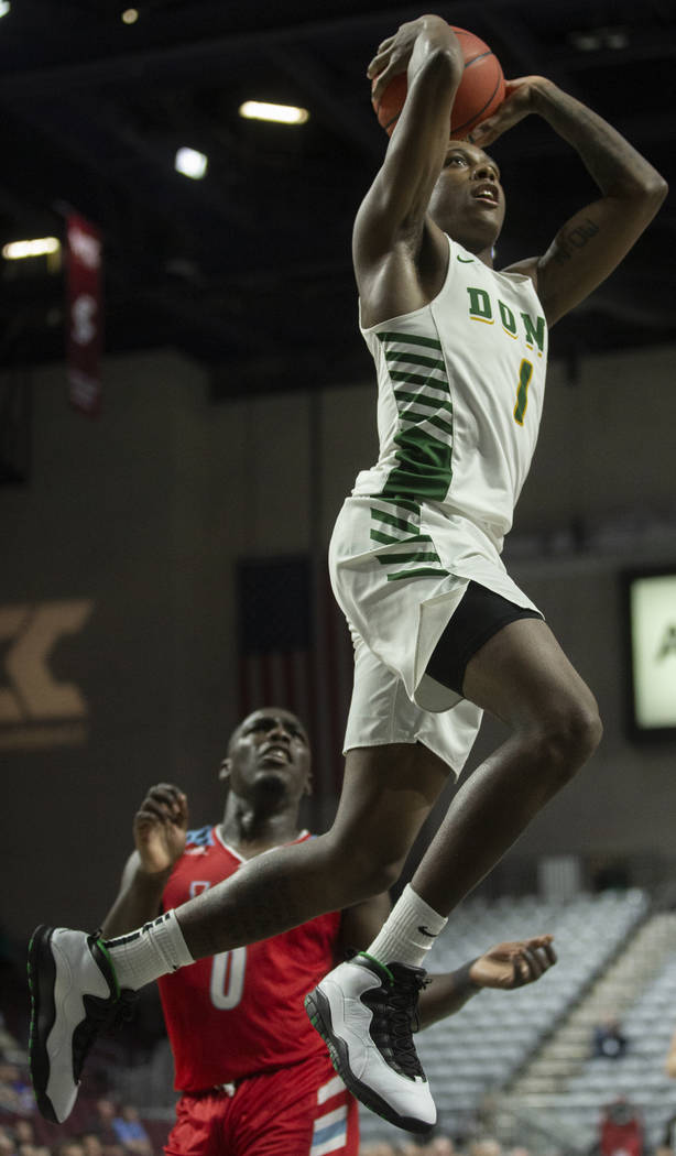San Francisco Dons guard Jamaree Bouyea (1) elevates for a dunk over Loyola Marymount Lions gua ...