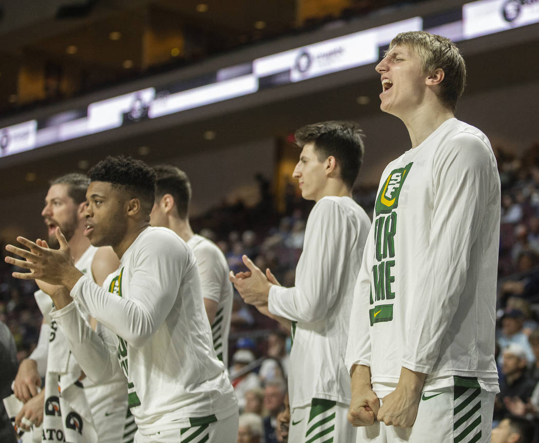 San Francisco Dons players celebrate after a big play in the first half during their West Coast ...