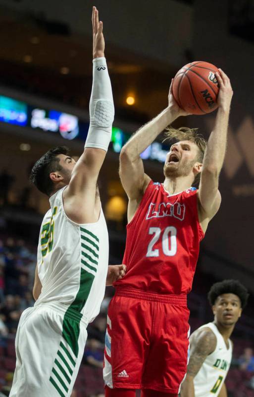 Loyola Marymount Lions guard Erik Johansson (20) shoots over San Francisco Dons guard Jordan Ra ...